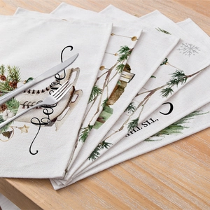 Christmas cotton linen table mats set featuring festive ice skates and snowflake motifs