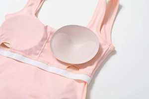 Detail showing removable padded chest inserts and inner lining of pink tennis dress