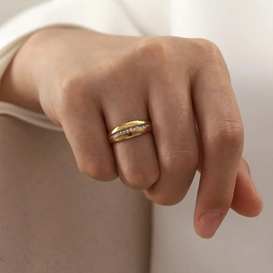 Elegant 18k gold plated titanium ring with single row cubic zirconia on hand
