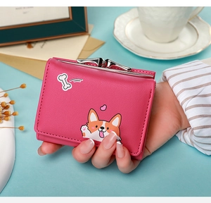 Close-up of a pink mini wallet featuring cute corgi print with silver snap buckle detail