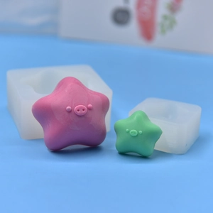 Star-shaped pig silicone mold set with finished resin crafts in purple and green