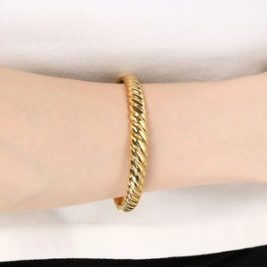 Golden twisted rope texture stainless steel open bangle bracelet for women on wrist