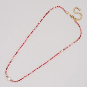 Handmade bohemian beaded necklace with colorful pearls and a gold lobster clasp
