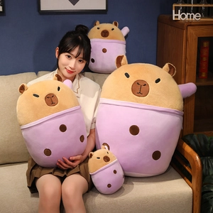 Macro detail of plush capybara toys in purple boba tea cups in various sizes