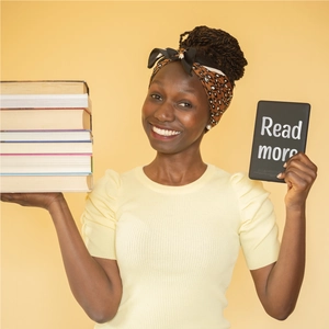 E-reader shown next to heavy books highlighting its lightweight and portable design
