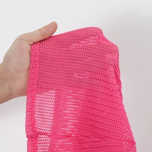 Detail of rose pink mesh fabric showing high breathability and fine grid structure