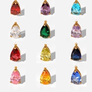 Detailed grid of twelve teardrop birthstone pendants with 18K gold plated settings