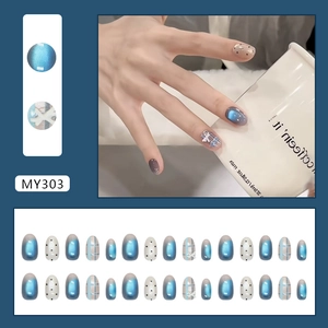 Blue cat-eye plaid press-on nails with white 3D bow accents and polka dot patterns