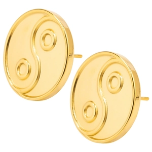 Macro view of gold stainless steel stud earrings featuring classic yin yang disc pattern