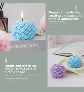Close-up of lit creative woven spherical scented candles in pastel blue and lilac