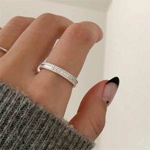 Detail of S925 sterling silver beaded ring with shimmering pavé zircon setting