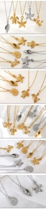 Detailed close-up of ocean-themed starfish and sea turtle charms in gold and silver finish