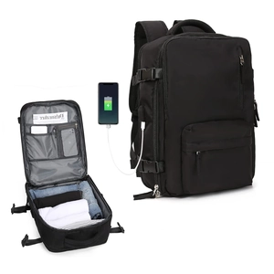 Detail of multi-compartment black travel backpack with USB charging port and interior space