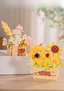 Close-up of building block rose and sunflower in woven basket textured pots