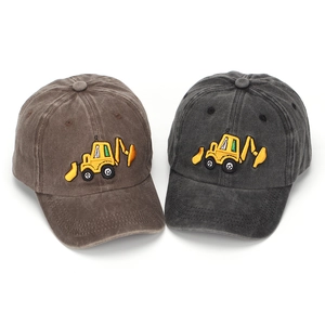 Close-up of embroidered excavator design on washed cotton kids baseball caps