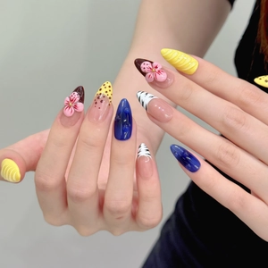 3D floral almond press-on nails with blue relief and yellow waves design