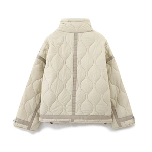 Back view of a beige quilted jacket with wave patterns and stand collar for women