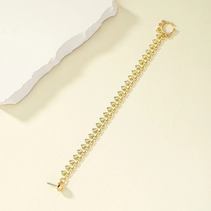 Golden ear chain with stud and cuff connector featuring textured metal discs design