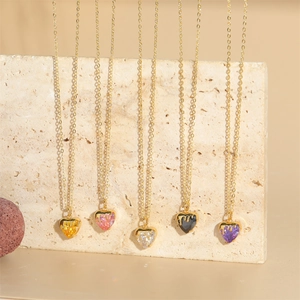 Minimalist gold necklaces with heart-shaped zircon pendants in five vibrant gemstone colors