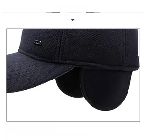 Detail of navy blue winter baseball cap with thick wool texture and ear protection flaps