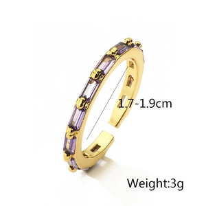 Detail view of adjustable gold copper ring with purple zircon including size measurements