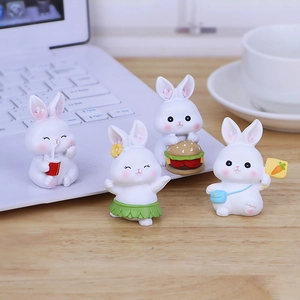 Set of four cute resin rabbit figurines for desk decor in various playful poses