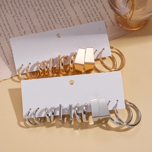 12-pair minimalist gold and silver geometric hoop earrings set on aesthetic background