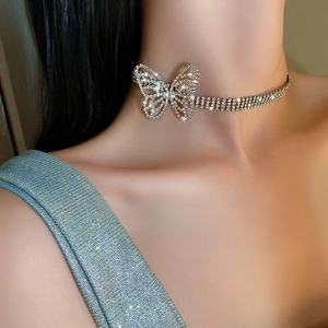 Close-up of sparkling silver butterfly choker necklace with rhinestones and multi-row chains