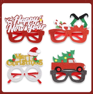 Set of four festive Christmas glasses with glitter textures and holiday characters