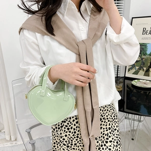 Fashionable mint green heart shaped jelly handbag with shiny patent leather finish