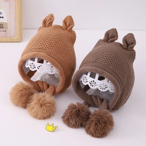 Winter baby knit earflap hat with cute animal ears and soft pom-poms in light brown