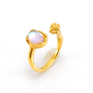 Irregular gold stainless steel open ring with oval moonstone and flower cluster detail