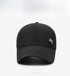 Detail view of black breathable baseball cap featuring side laser-cut vents and gold logo