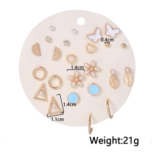 Set of 12 gold-tone earrings with pearls, rhinestones, butterflies and floral designs