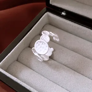Modern white matte oval crumpled open ring featuring unique hammer texture design