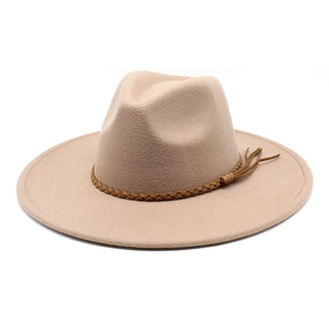 Detail view of beige wool fedora hat featuring a woven brown leather belt and tassel