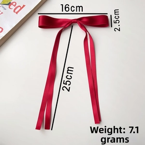 Detail view of dark red satin ribbon bow hair clip with dimension measurement guide