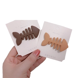Set of 2 minimalist candy-colored fishbone hair clips in matte brown and beige