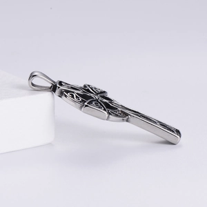 Detailed macro shot of vintage silver Celtic knot pendant on minimalist background