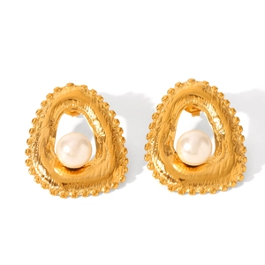 Detailed macro shot of golden flower earrings with white pearl center for women