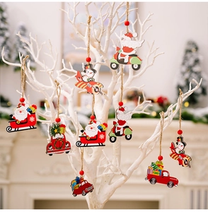 Detailed view of wooden Christmas ornaments featuring Santa on motorcycle and snowman plane