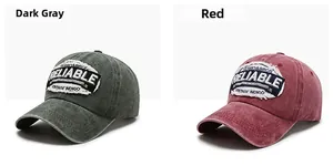 Detail of vintage washed cotton baseball caps in dark grey and burgundy with embroidery