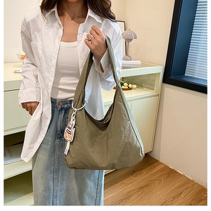 Olive green tote bag with natural texture shown on model for daily casual wear