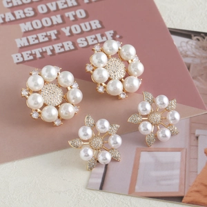 Elegant gold earrings set featuring pearl flower design and sparkling zircon snowflake studs