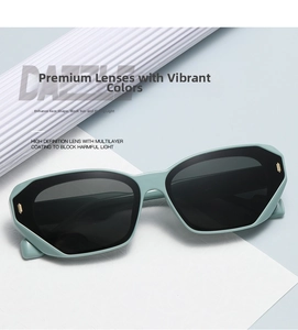 Detail of mint green geometric sunglasses with gold accents on a stylish wavy background