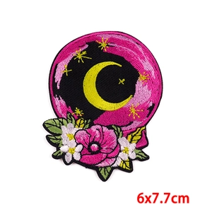 Detailed view of moon and poppy flower embroidery patch with 6x7.7cm size scale