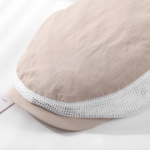 Close-up of the khaki checkered fabric and white breathable mesh on this kids cap