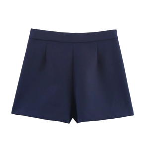 Detailed view of high-waist A-line dark blue shorts with front pleats and smooth fabric