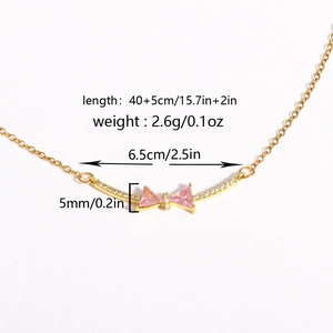18K gold plated bow necklace with pink zircon pendant for women on a white background