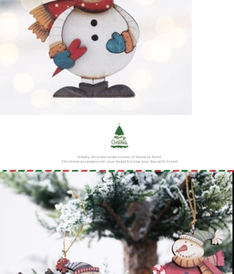 Macro detail of painted wooden snowman ornament with Christmas tree hanging display